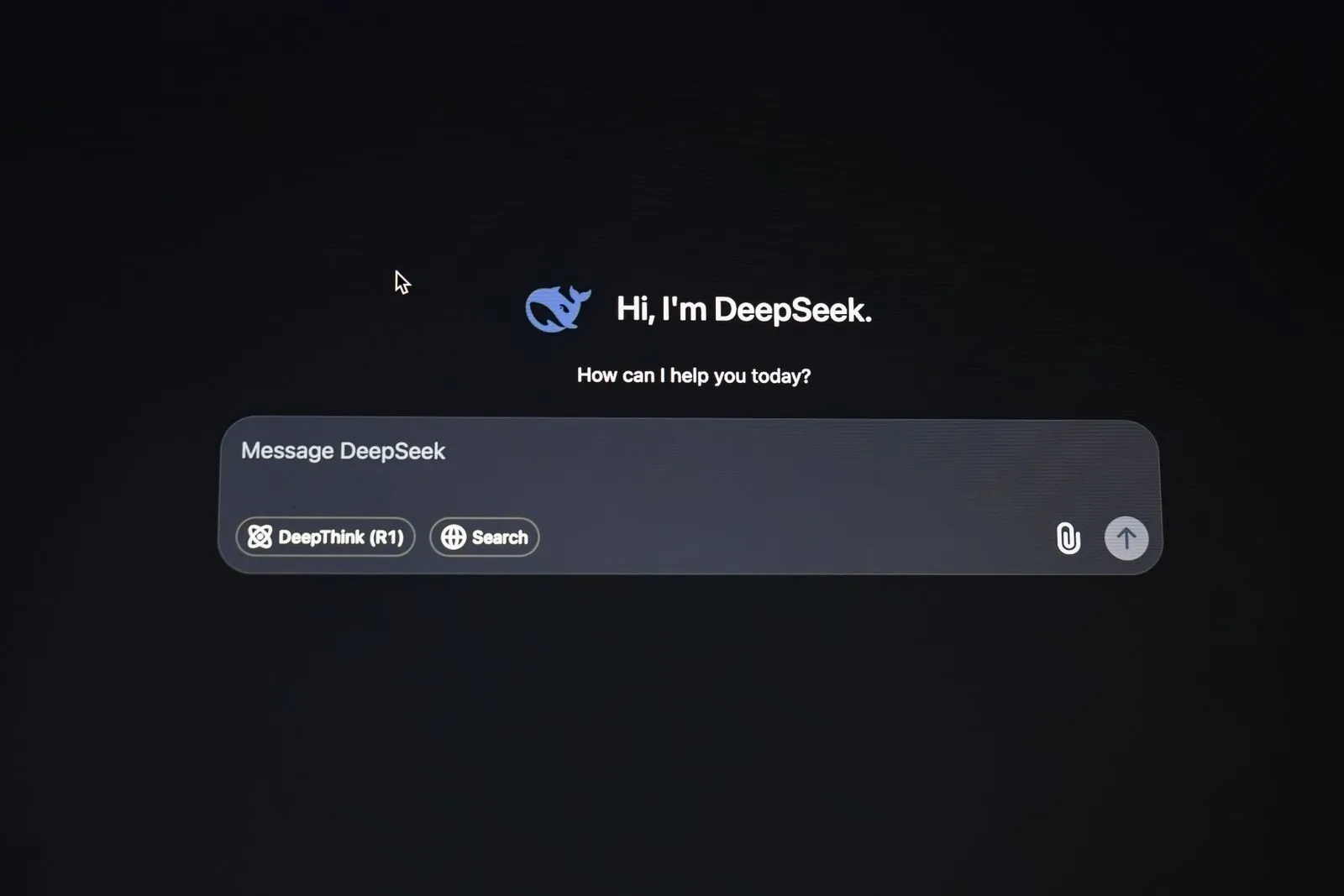 Dark-mode DeepSeek AI chat screen with welcome prompt and message box showing DeepThink and Search toggles