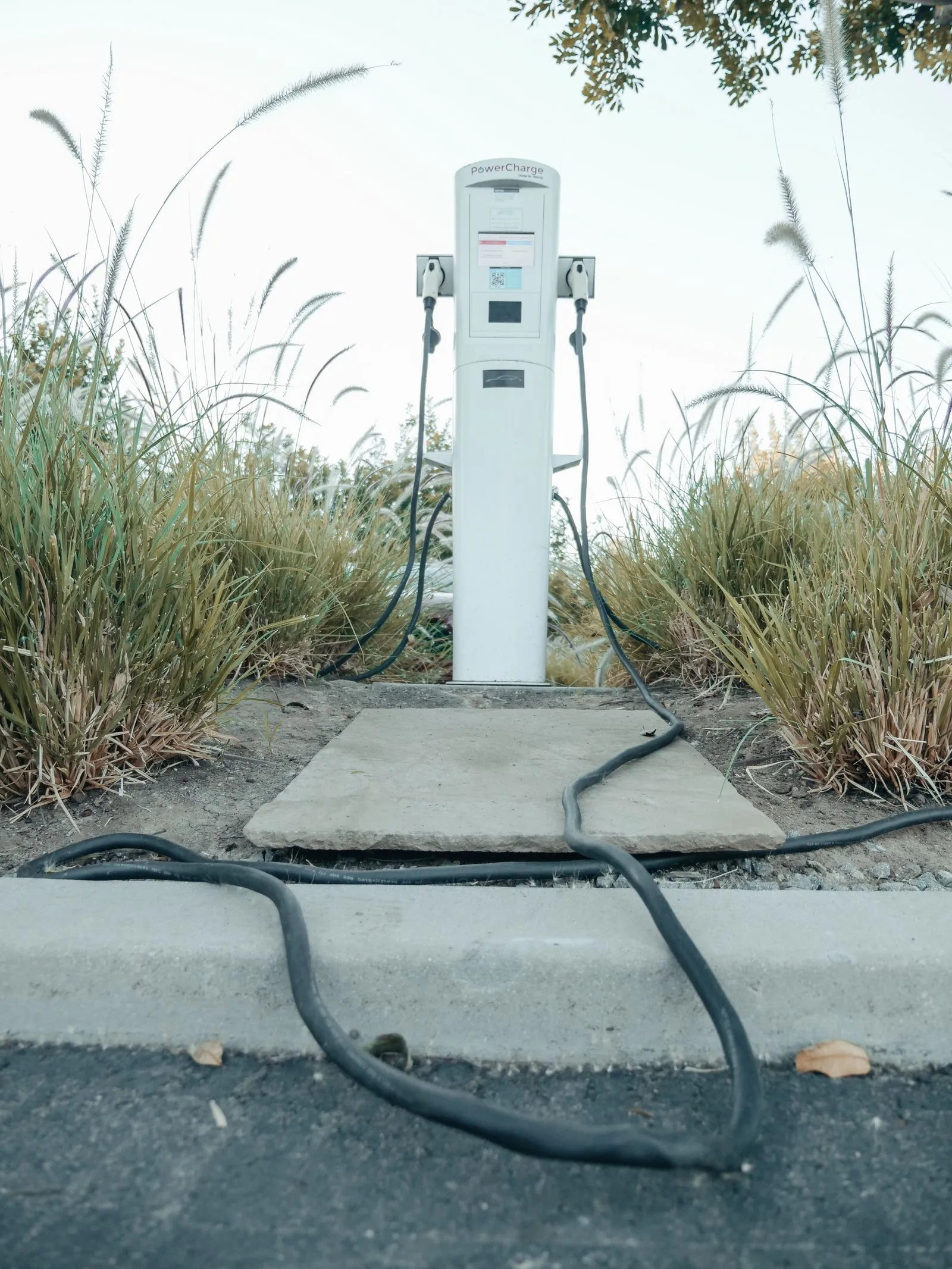 Electric vehicle charging at a station