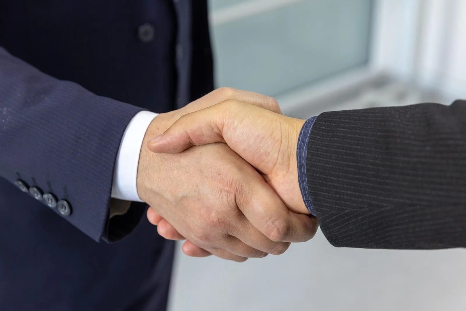 Business partners shaking hands on an agreement