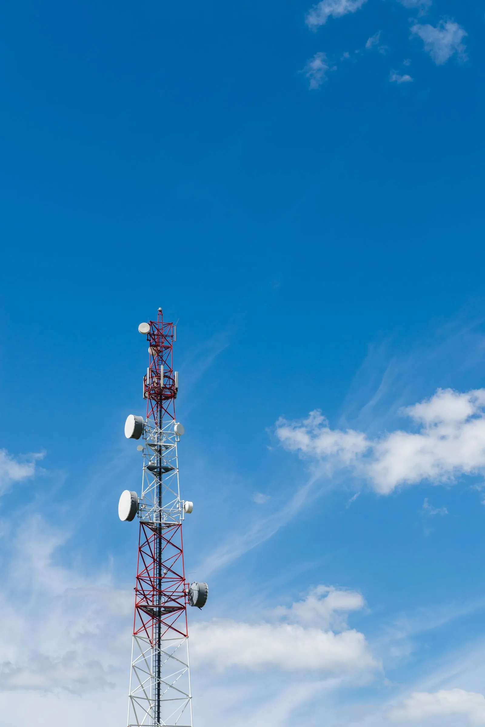 Telecommunications tower against a blue sky