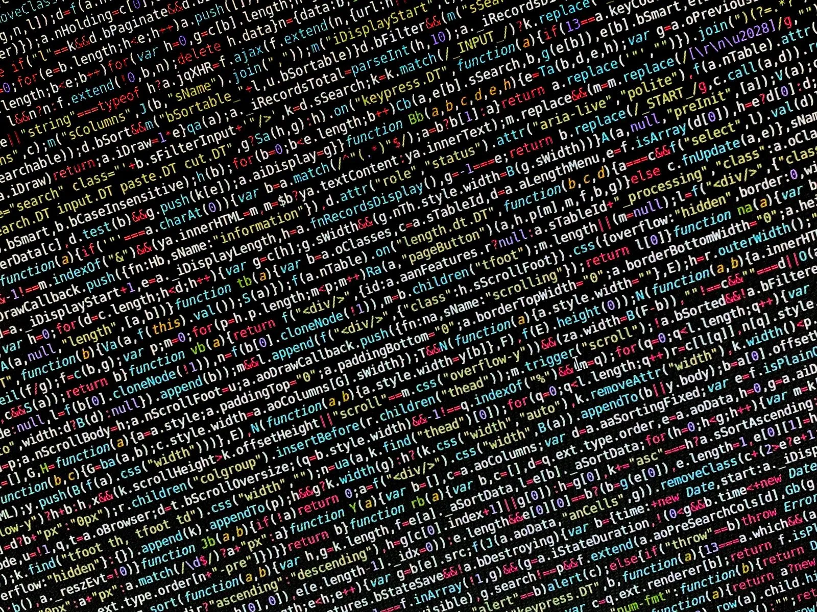 Diagonal close-up of minified JavaScript code referencing a DataTable sorting plugin